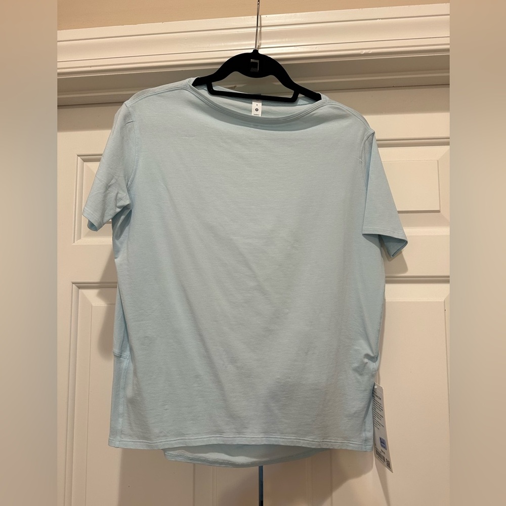 Light blue lululemon short sleeve back in action top
